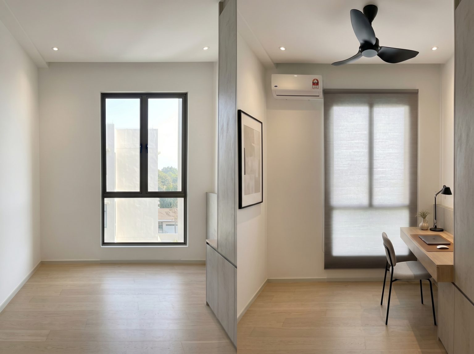 Minimalist home office with honeycomb blinds providing glare protection and privacy for a focused workspace.