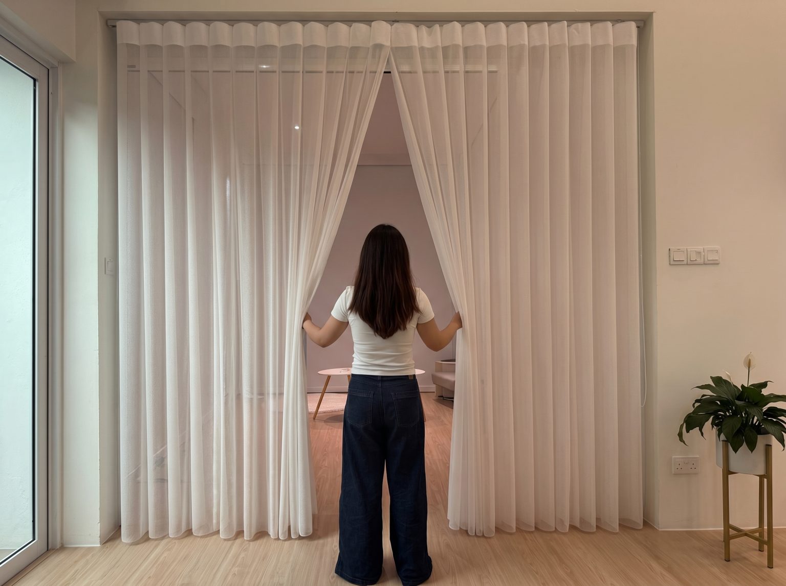 Full-length Dream curtain Singapore providing a blend of sheer elegance and vertical blind control.