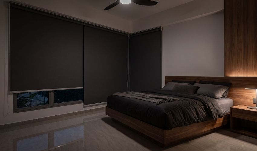 Blackout roller blinds installed in a bedroom in Bukit Timah, Singapore.